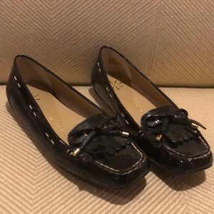 Black flats with tassels